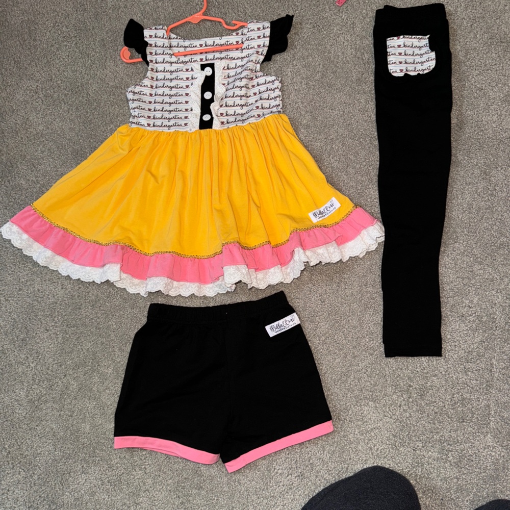 Yellow and Pink Ruffled Dress with Black Leggings